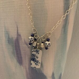 Broken china pendant with freshwater pearl accents